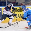 MINSK, BELARUS - MAY 17: Slovakia's Juraj Mikus #71 pulls the puck away from Italy's Christian Borgatello #50 during preliminary round action at the 2014 IIHF Ice Hockey World Championship. (Photo by Richard Wolowicz/HHOF-IIHF Images)
